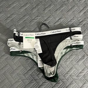 Women’s Calvin Klein Thong set of 3 - black, grey, green plaid. 
Size L.